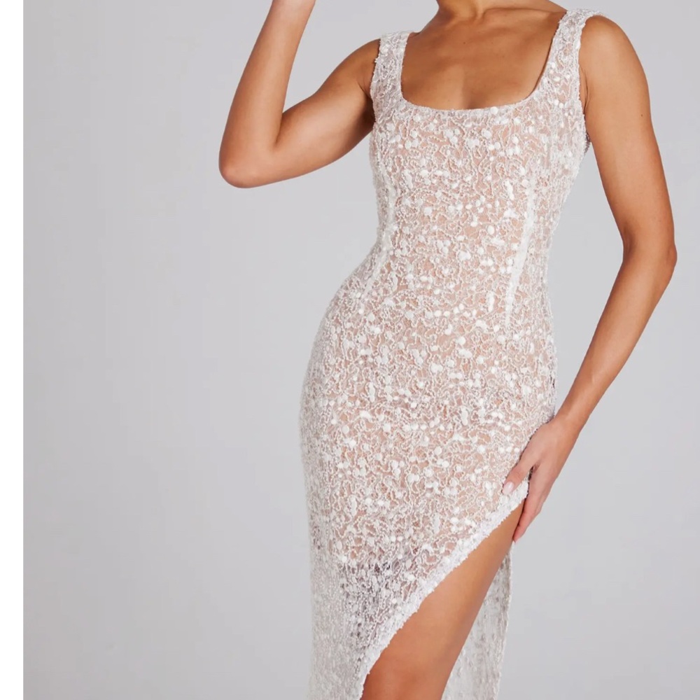 Brand new with tag and the box. Louisa Sequin Lace Gown
NADINE MERABI